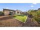 Expansive backyard featuring a trampoline, gazebo, and well-maintained landscaping at 20458 W Briarwood Dr, Buckeye, AZ 85396