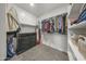 Walk-in closet featuring built in shelves, ample storage space and soft carpeted flooring at 20458 W Briarwood Dr, Buckeye, AZ 85396