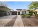 Charming single-story home with a well-manicured front yard and paved driveway at 20458 W Briarwood Dr, Buckeye, AZ 85396