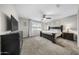 Spacious primary bedroom features dark wood furnishings, carpet flooring, neutral walls and natural light at 20458 W Briarwood Dr, Buckeye, AZ 85396