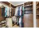 Walk-in closet with custom built-ins, shelving, and ample storage space at 2119 E Daley Ln, Phoenix, AZ 85024