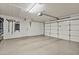Spacious two-car garage with epoxy floor and white walls at 2119 E Daley Ln, Phoenix, AZ 85024