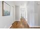 Hallway with hardwood flooring leading to the front door at 2119 E Daley Ln, Phoenix, AZ 85024
