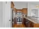 Well-equipped kitchen with stainless steel appliances, granite countertops, and ample cabinet space at 2119 E Daley Ln, Phoenix, AZ 85024
