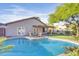 Backyard pool with lounge chairs and covered patio at 2119 E Daley Ln, Phoenix, AZ 85024
