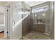 Walk-in shower with glass enclosure, tile surround, and rainfall shower head at 2119 E Daley Ln, Phoenix, AZ 85024