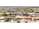 Residential home in a community setting, surrounded by neighboring houses and featuring ample parking at 2132 W Chambers St, Phoenix, AZ 85041