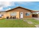 Charming single-story home with a well-maintained lawn and inviting front patio seating at 2132 W Chambers St, Phoenix, AZ 85041