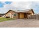 A charming single-story home features an inviting front patio and a convenient covered carport at 2132 W Chambers St, Phoenix, AZ 85041