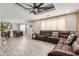 Open-concept living room with a dining area, stylish flooring, recessed lights, and comfortable seating at 2132 W Chambers St, Phoenix, AZ 85041