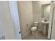Bathroom featuring toilet and sink at 25138 W Wayland Dr, Buckeye, AZ 85326