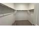 Spacious walk-in closet featuring ample shelving and organizational space at 25138 W Wayland Dr, Buckeye, AZ 85326