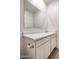 Bathroom showcasing a sleek mirror, updated vanity, and neutral finishes at 25455 N 183Rd Dr, Wittmann, AZ 85361