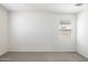 Neutral bedroom features carpet, one window with blinds, and electrical outlets for convenience at 25455 N 183Rd Dr, Wittmann, AZ 85361