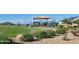 A community playground with slides and climbing structures provides recreational opportunities for children in a Gathering-friendly area at 25455 N 183Rd Dr, Wittmann, AZ 85361