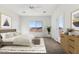 Cozy bedroom with a large window, light-colored walls, and comfortable furnishings at 25720 W White Feather Ln, Wittmann, AZ 85361