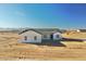 Newly built home featuring modern design, desert landscaping and mountain views at 25852 W White Feather Ln, Wittmann, AZ 85361