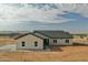 Lovely single-story home showcasing the desert landscape with a neutral palette and stylish architectural design at 25876 W White Feather Ln, Wittmann, AZ 85361