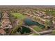 Aerial view of a residential community with a golf course and ponds at 25995 W Sierra Pinta Dr, Buckeye, AZ 85396
