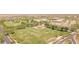 Aerial view of a community park featuring a baseball field and grassy fields at 25995 W Sierra Pinta Dr, Buckeye, AZ 85396