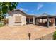 Landscaped backyard with an outdoor gazebo and patio at 25995 W Sierra Pinta Dr, Buckeye, AZ 85396