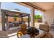 Backyard with patio furniture, a fire pit, and shade at 25995 W Sierra Pinta Dr, Buckeye, AZ 85396
