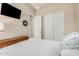 This bedroom includes closet space, a TV, and neutral paint at 25995 W Sierra Pinta Dr, Buckeye, AZ 85396