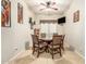 Cozy dining room with a glass-top table, comfortable seating, and natural light creates a welcoming atmosphere at 25995 W Sierra Pinta Dr, Buckeye, AZ 85396