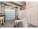 Well-lit garage with ample storage, cabinets, and workspace area at 25995 W Sierra Pinta Dr, Buckeye, AZ 85396