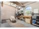 Organized garage featuring built-in storage, workbench, and natural light at 25995 W Sierra Pinta Dr, Buckeye, AZ 85396