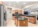 Well-equipped kitchen with stainless steel appliances, granite countertops, and a large island for food preparation at 25995 W Sierra Pinta Dr, Buckeye, AZ 85396