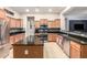 Spacious kitchen with a large island, stainless steel appliances, granite countertops, and plenty of cabinet space at 25995 W Sierra Pinta Dr, Buckeye, AZ 85396