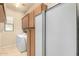 Laundry area with washer, dryer, utility sink, and storage at 25995 W Sierra Pinta Dr, Buckeye, AZ 85396