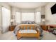Serene main bedroom with a bay window, light-colored walls, and neutral decor at 25995 W Sierra Pinta Dr, Buckeye, AZ 85396
