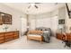 Serene main bedroom with a bay window, light-colored walls, and neutral decor at 25995 W Sierra Pinta Dr, Buckeye, AZ 85396