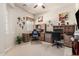 Bright home office with dual workstations, ceiling fan, and comfortable seating at 25995 W Sierra Pinta Dr, Buckeye, AZ 85396