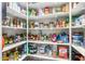 Well-stocked walk-in pantry with white shelving and ample storage for food items at 25995 W Sierra Pinta Dr, Buckeye, AZ 85396