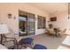 Covered outdoor patio with furnishings and ceiling fan at 25995 W Sierra Pinta Dr, Buckeye, AZ 85396