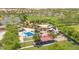 Aerial view of a splash pad and shaded playground in a well-maintained park at 25995 W Sierra Pinta Dr, Buckeye, AZ 85396