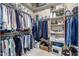 Spacious walk-in closet with rods and shelves for organized storage of clothes and accessories at 25995 W Sierra Pinta Dr, Buckeye, AZ 85396
