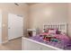 Bedroom featuring a single bed with neutral walls, carpeted floors, and closet at 2922 N 107Th Dr, Avondale, AZ 85392