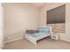 Bedroom featuring a single bed with neutral walls and carpeted floors at 2922 N 107Th Dr, Avondale, AZ 85392