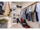 Spacious walk-in closet with built-in shelves and hanging racks for organized storage at 2922 N 107Th Dr, Avondale, AZ 85392
