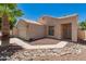 Charming home with desert landscaping, complemented by a two-car garage and easy access to the front door at 2922 N 107Th Dr, Avondale, AZ 85392