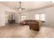 An inviting living room connects to a dining area, complemented by tile floors and neutral wall colors at 2922 N 107Th Dr, Avondale, AZ 85392