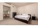 Bright and airy main bedroom suite featuring an ensuite bathroom and carpeted floors at 2922 N 107Th Dr, Avondale, AZ 85392