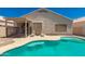 Backyard swimming pool and patio with lounge chairs at 2922 N 107Th Dr, Avondale, AZ 85392