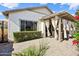 The backyard has a covered patio, pavers, and professional landscaping at 3163 E Austin Dr, Gilbert, AZ 85296