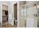 Modern bathroom with glass-enclosed shower, walk-in closet, and a separate water closet at 3163 E Austin Dr, Gilbert, AZ 85296