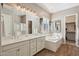 Bright bathroom with double vanity, soaking tub, walk-in shower, and elegant fixtures at 3163 E Austin Dr, Gilbert, AZ 85296